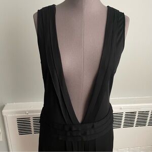 St. John couture black sleeveless dress with deep plunge neckline and drop waist